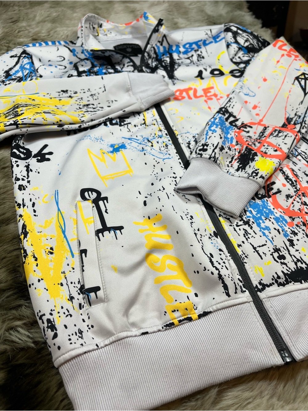 Encrypted White Graffiti-Print Zip Jacket with Yellow & Blue Accents